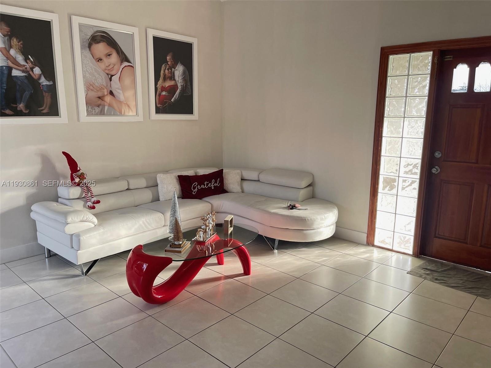 20420 Southwest 124th Place, Unit 20420 Miami, FL 33177 - Photo 5 of 16 a living room with furniture and window