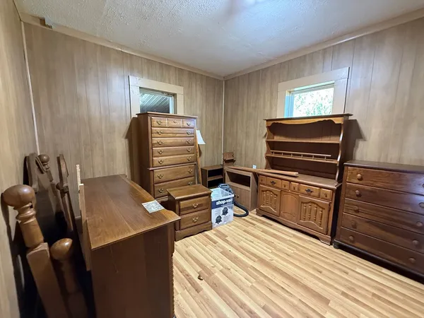 a bedroom with a bed and furniture