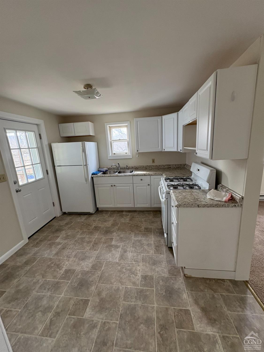 1013 Plank Road Poestenkill, NY 12018 - Photo 37 of 49 a large white kitchen with cabinets