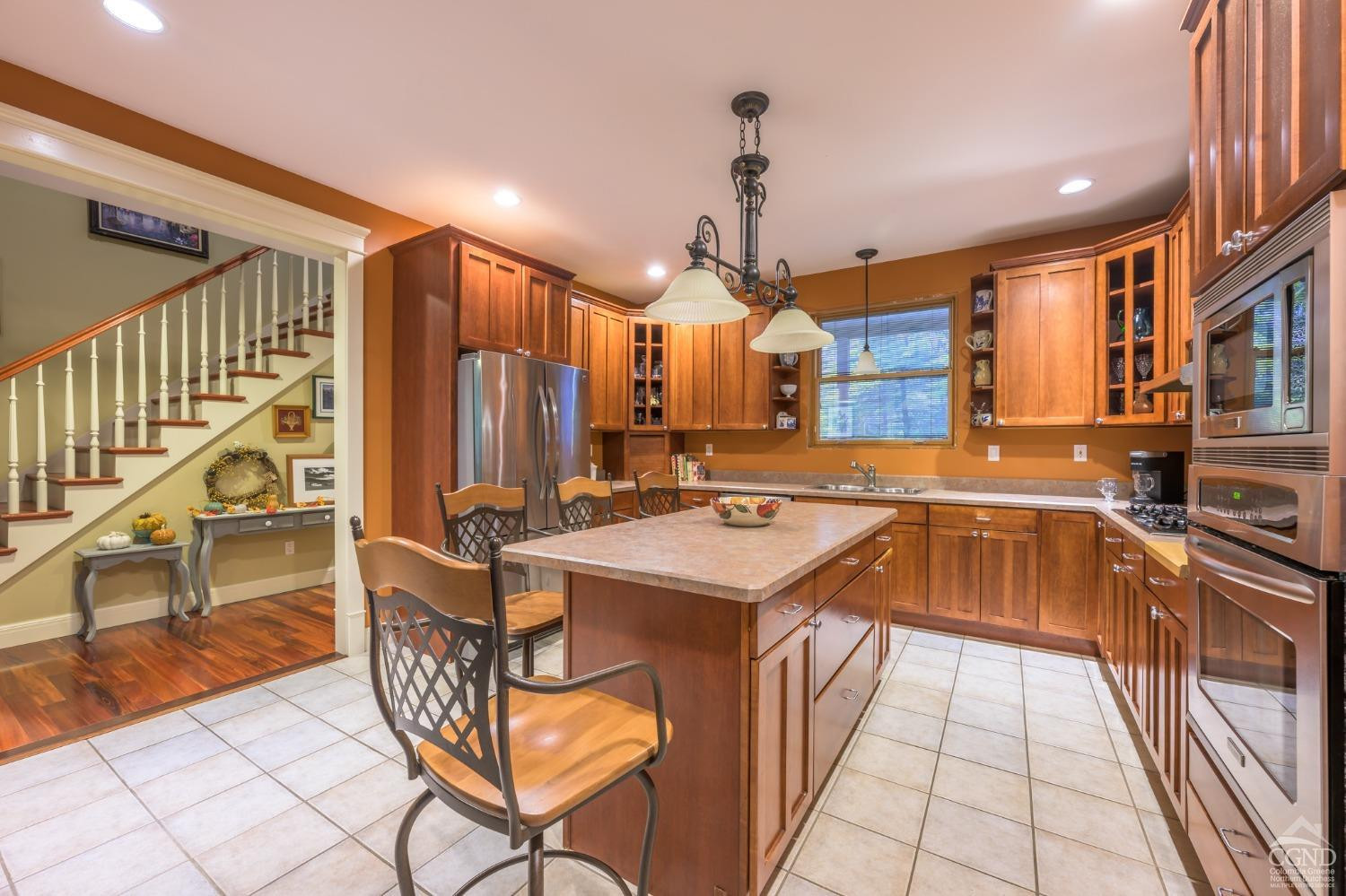 1013 Plank Road Poestenkill, NY 12018 - Photo 5 of 49 a kitchen with stainless steel appliances granite countertop a sink and cabinets