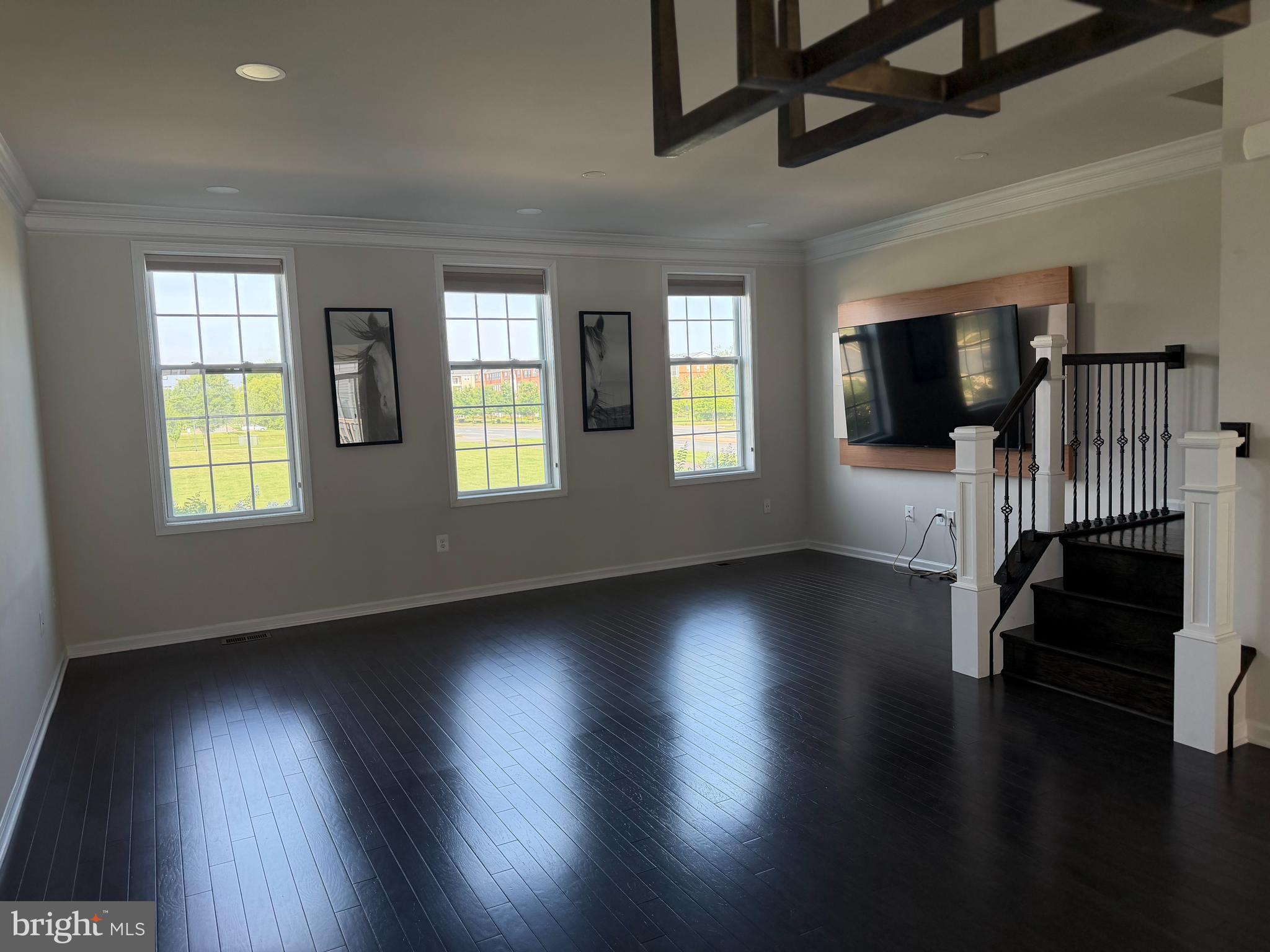 23463 Simms Gap Way Ashburn, VA 20148 - Photo 6 of 10 a view of a livingroom with furniture wooden floor and windows