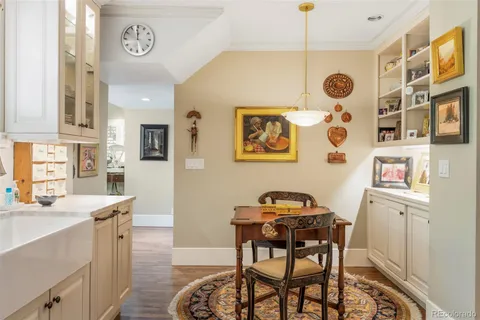 a view of a kitchen filled with furniture and furniture