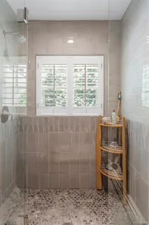a bathroom with a sink and a shower