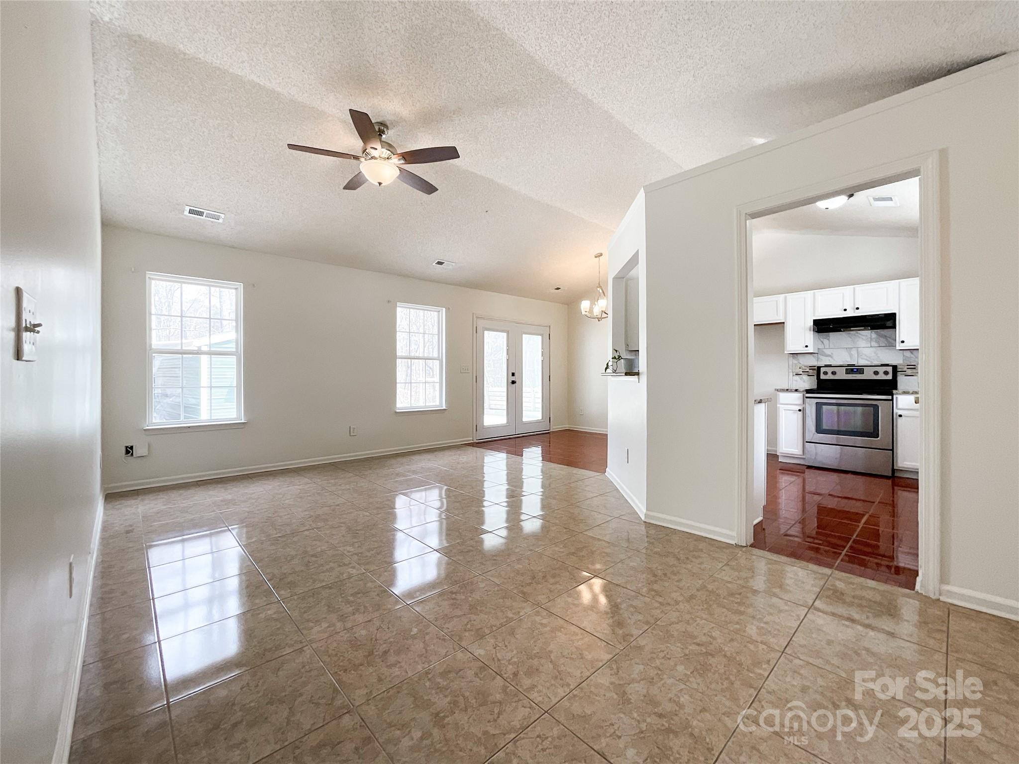 5610 Stone Bluff Court Charlotte, NC 28214 - Photo 1 of 41 a view of a livingroom with a furniture ceiling fan and window
