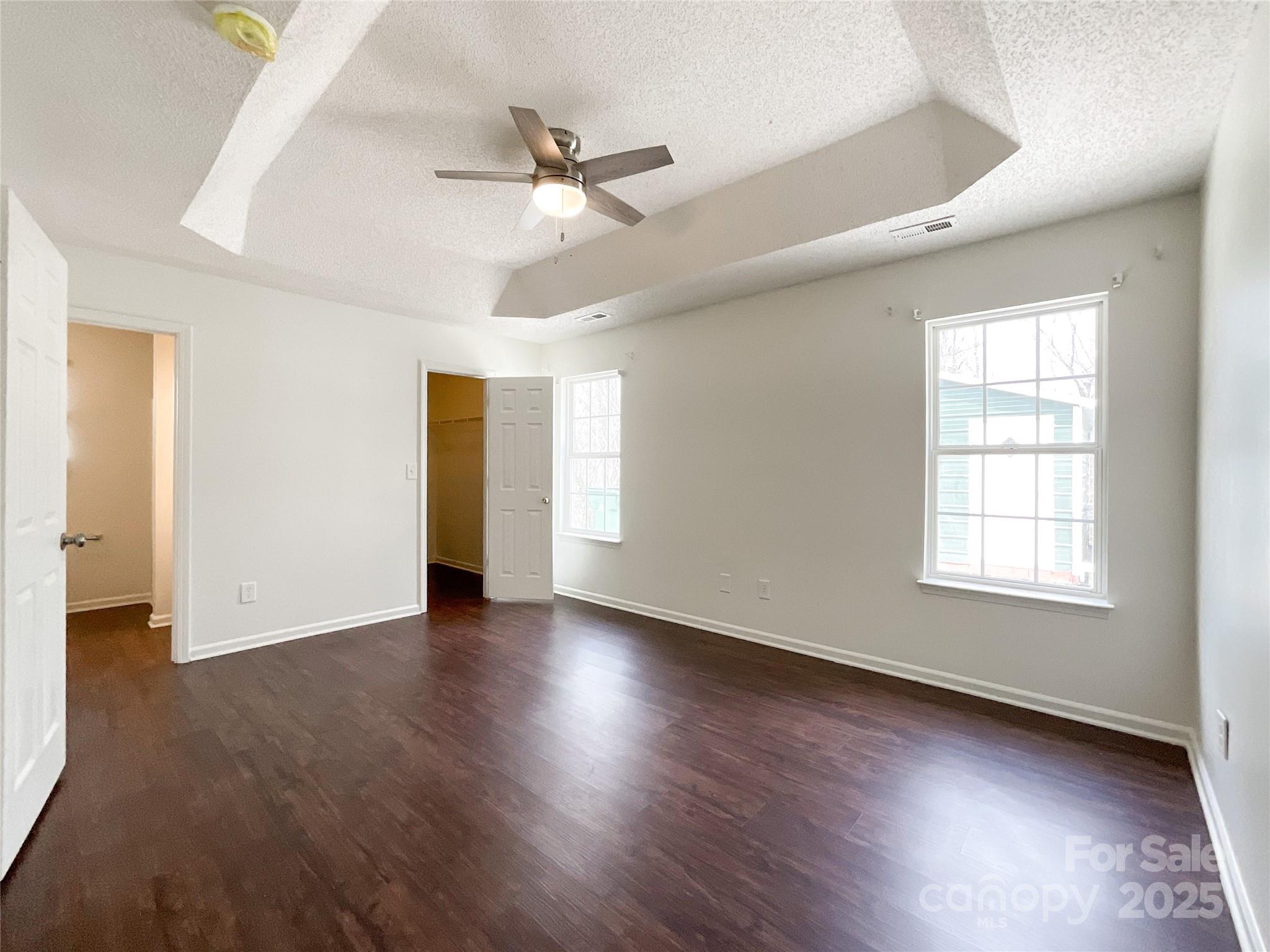 5610 Stone Bluff Court Charlotte, NC 28214 - Photo 24 of 41 a view of an empty room with wooden floor and a window