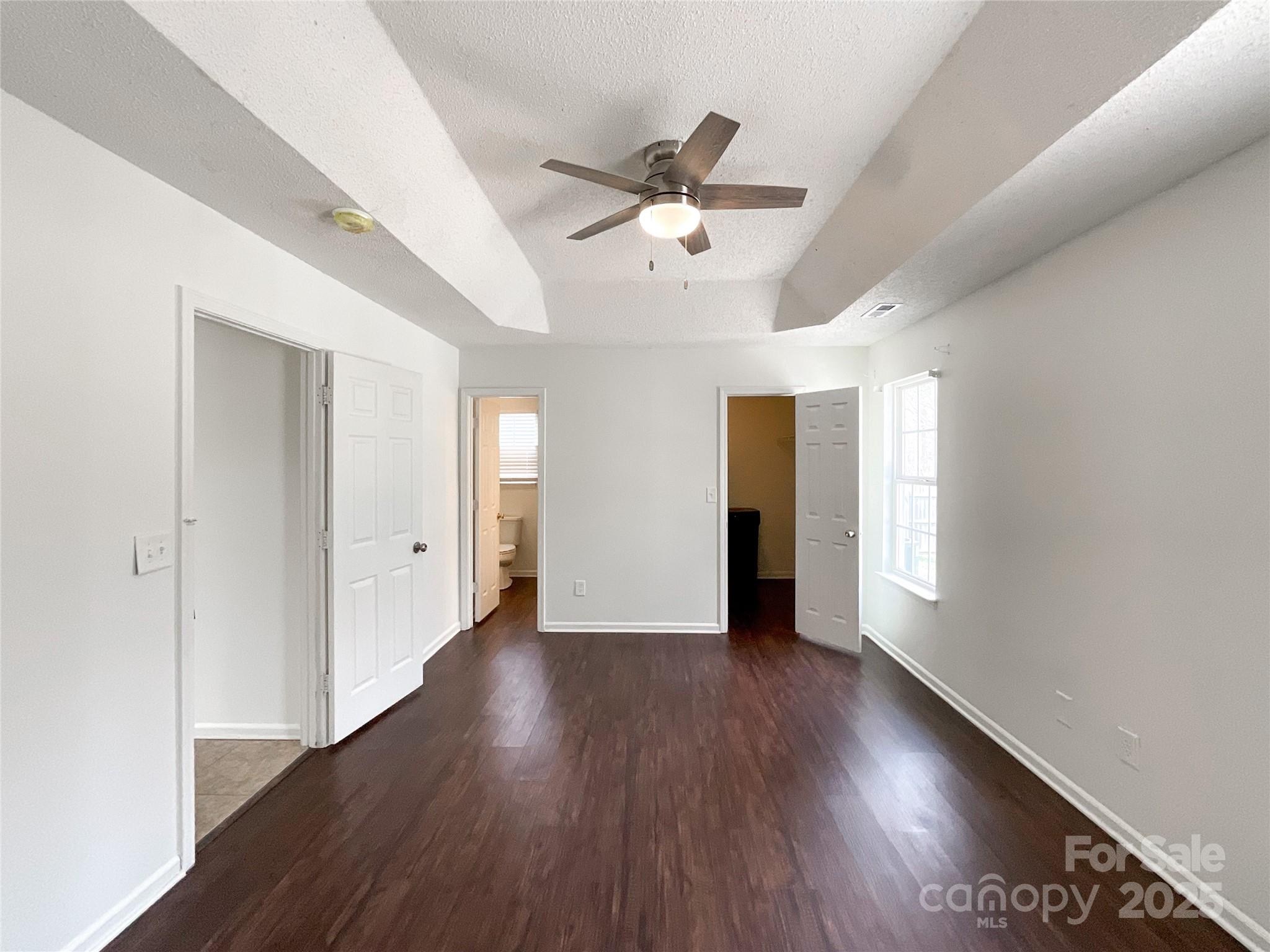 5610 Stone Bluff Court Charlotte, NC 28214 - Photo 25 of 41 wooden floor in an empty room with a window