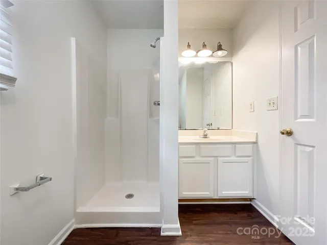 a white toilet sitting next to a bathroom sink and tub