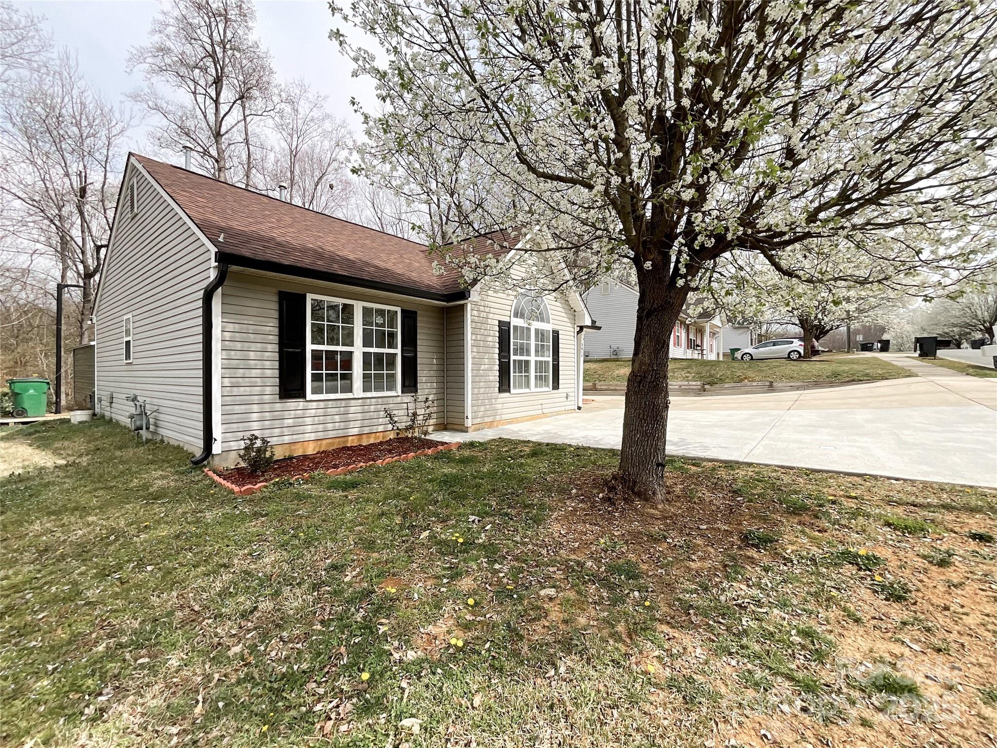 5610 Stone Bluff Court Charlotte, NC 28214 - Photo 34 of 41 a house with trees in front of it