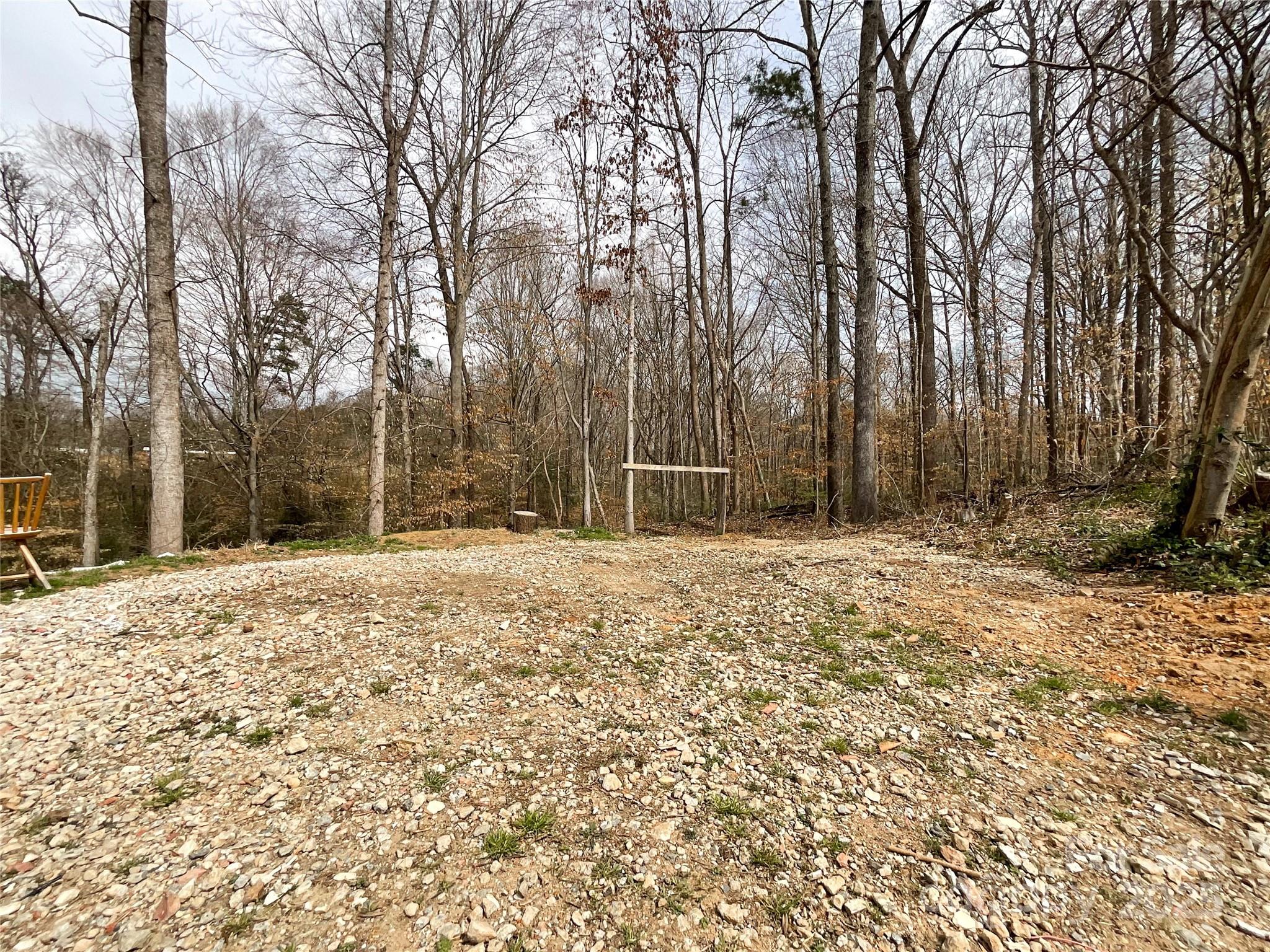 5610 Stone Bluff Court Charlotte, NC 28214 - Photo 39 of 41 a house with trees in front of it