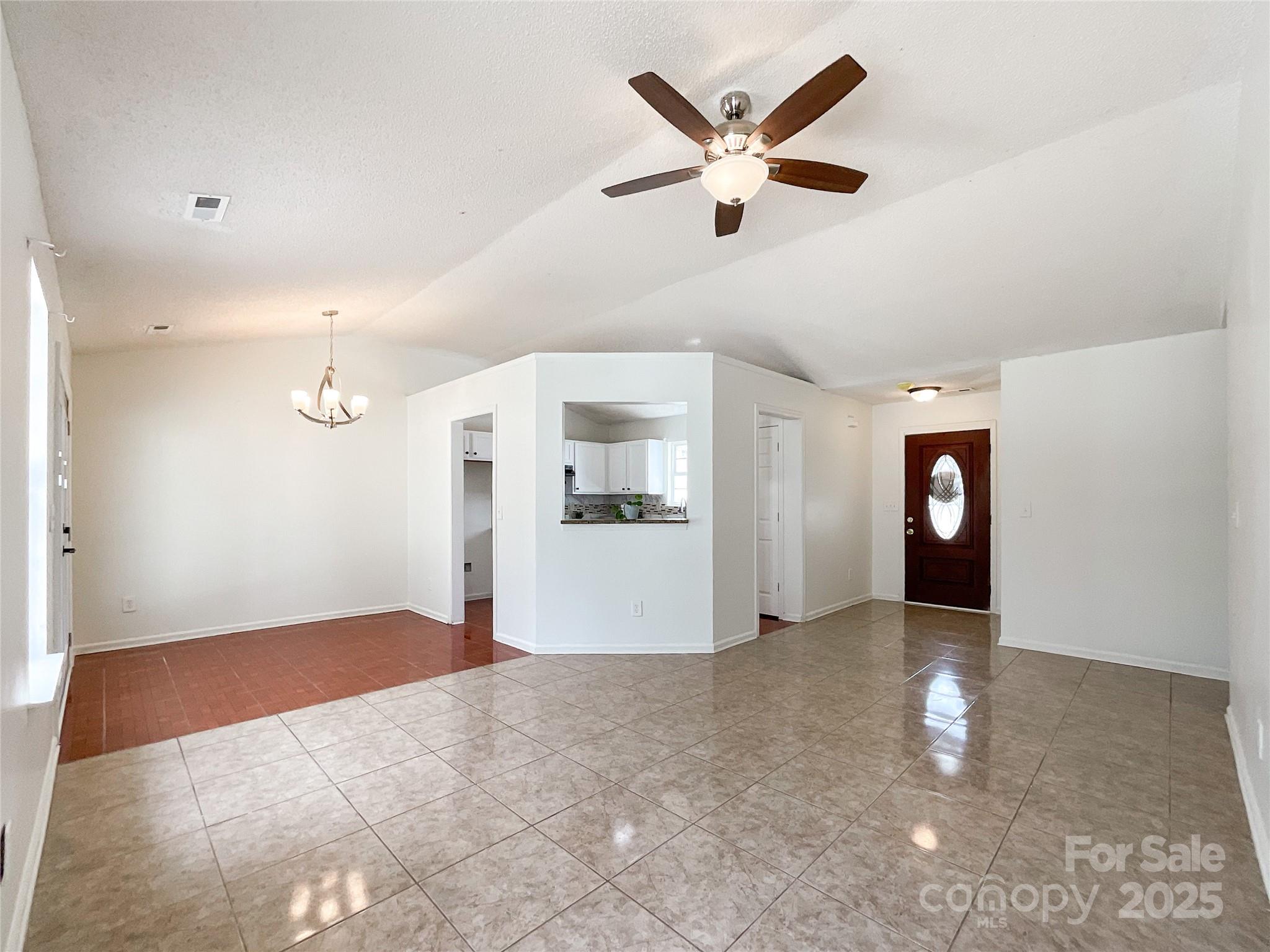 5610 Stone Bluff Court Charlotte, NC 28214 - Photo 7 of 41 a view of a livingroom with a ceiling fan and window