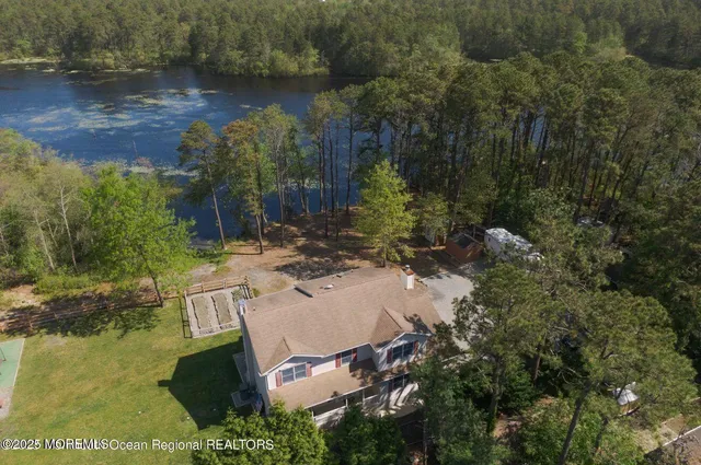 a view of backyard with outdoor space and trees