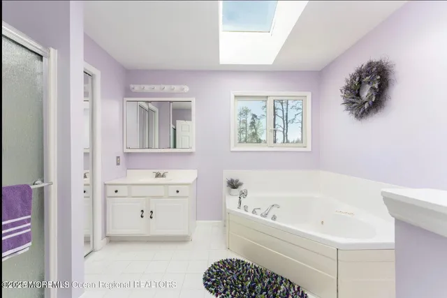 a bedroom with a bed window and a window