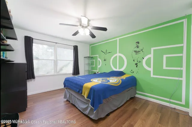 a white toilet sitting next to a bathroom sink and a tub