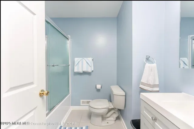 a view of a deck with table and chairs and wooden floor