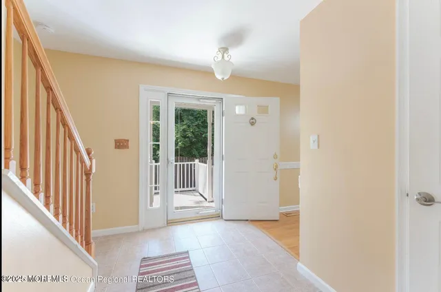 a large kitchen with stainless steel appliances granite countertop a stove oven and a refrigerator