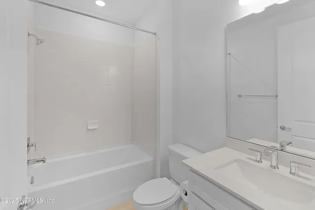 a bathroom with a sink toilet and bathtub