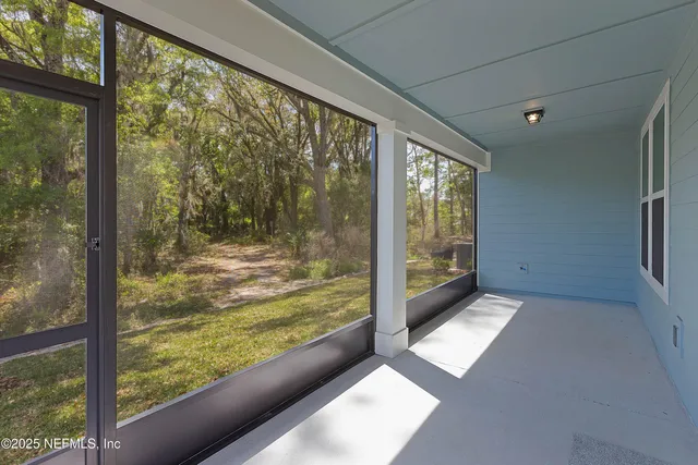 a view of a glass door and an outdoor space