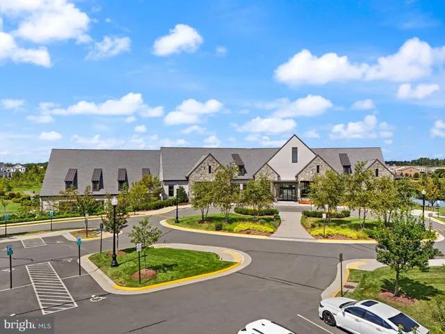 a front view of house with yard swimming pool and outdoor seating