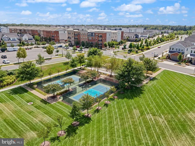 a view of a lake with houses in the back