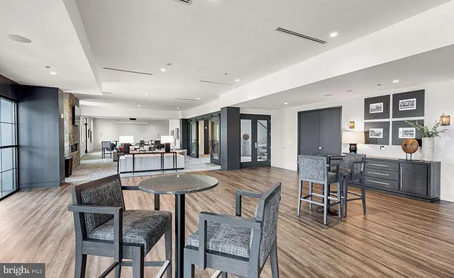 a view of a swimming pool and dining room
