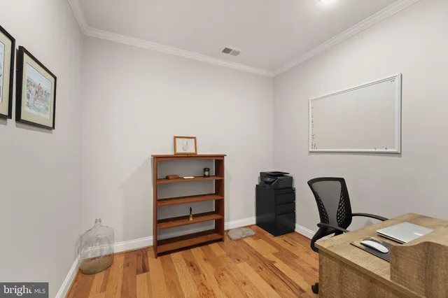 a bedroom with a bed and a chair