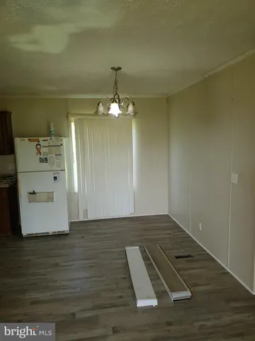 a view of a livingroom with wooden floor