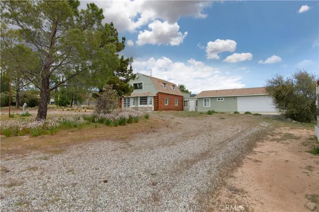 a view of a house with a dry yard