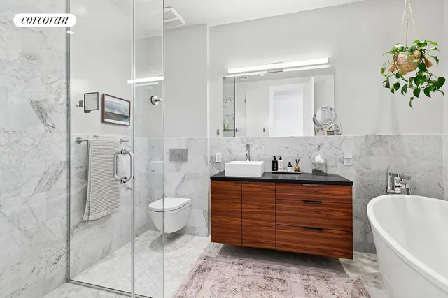 a bedroom with a large bed and a large window