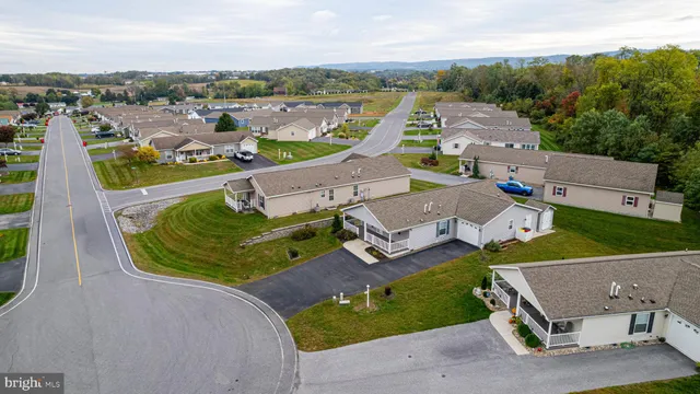an aerial view of a house with outdoor space and lake view
