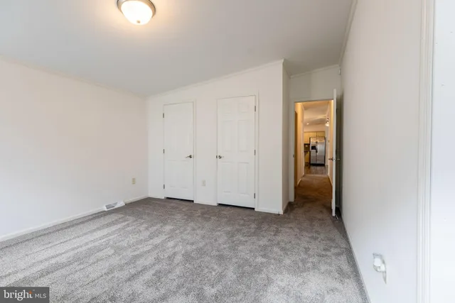 an empty room with closet area