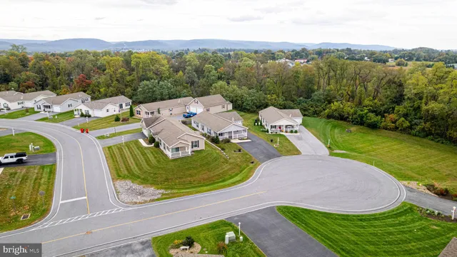 an aerial view of a house with a swimming pool