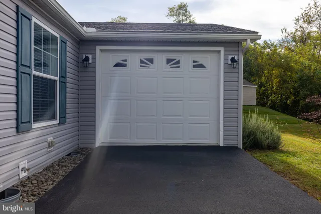 a view of a house with a small yard