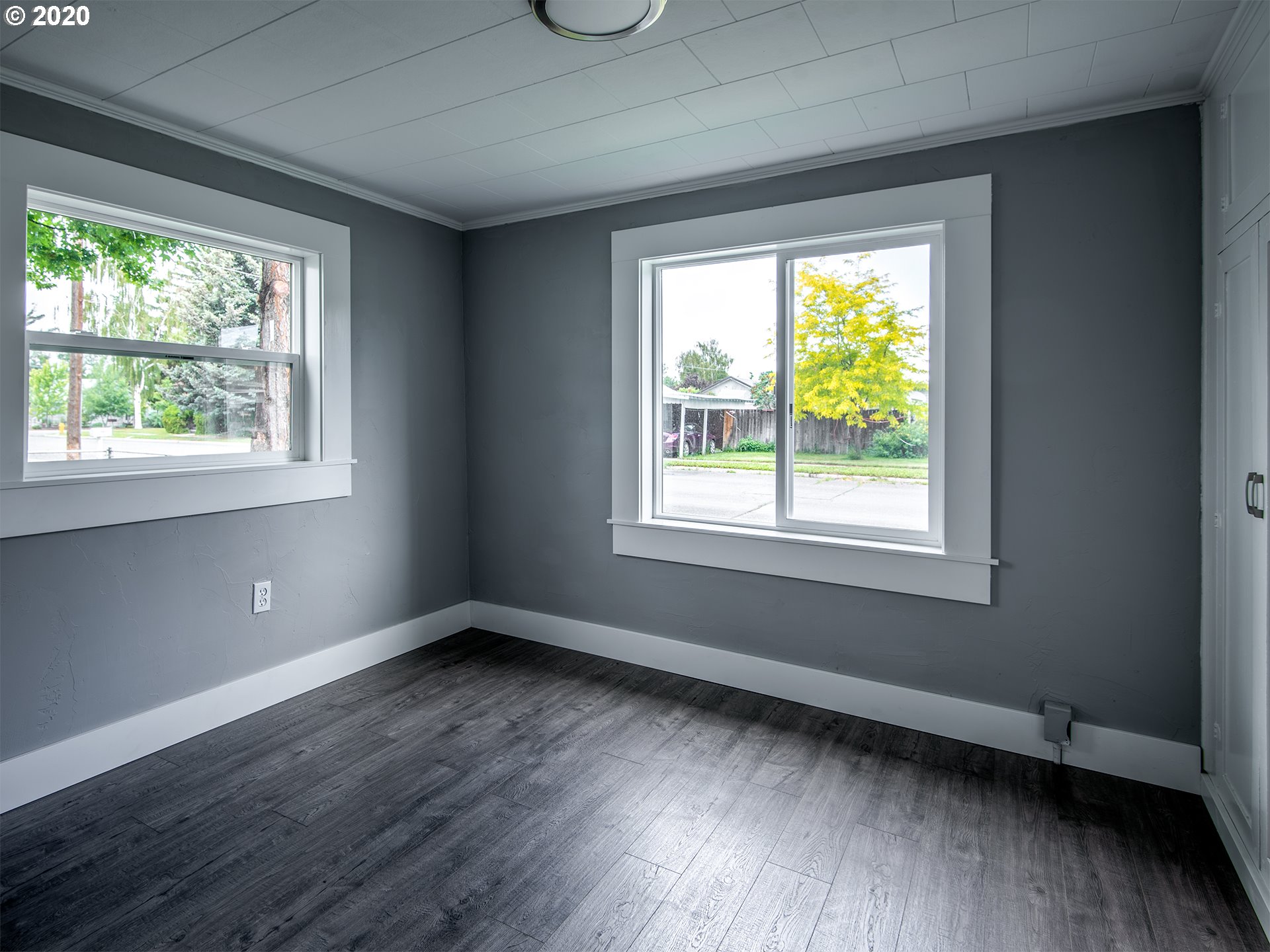 1037 Walnut Street Baker City, OR 97814 - Photo 8 of 14 a view of an empty room with wooden floor and a window