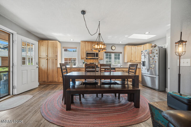 1931 Lousetown Road Reno, NV 89521 - Photo 29 of 51 a view of a dining room with furniture window and wooden floor