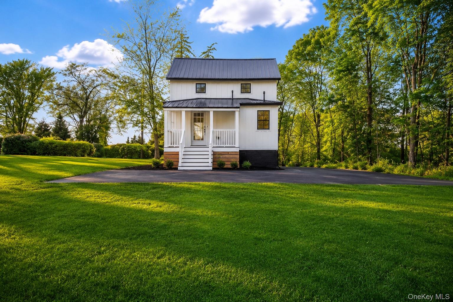 386 Lakeside Road Newburgh, NY 12550 - Photo 5 of 31 a front view of a house with a yard