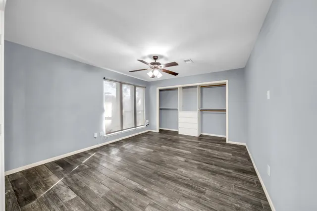 a swimming pool with outdoor seating and garden