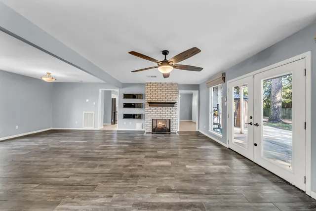a kitchen with stainless steel appliances a refrigerator and a stove top oven