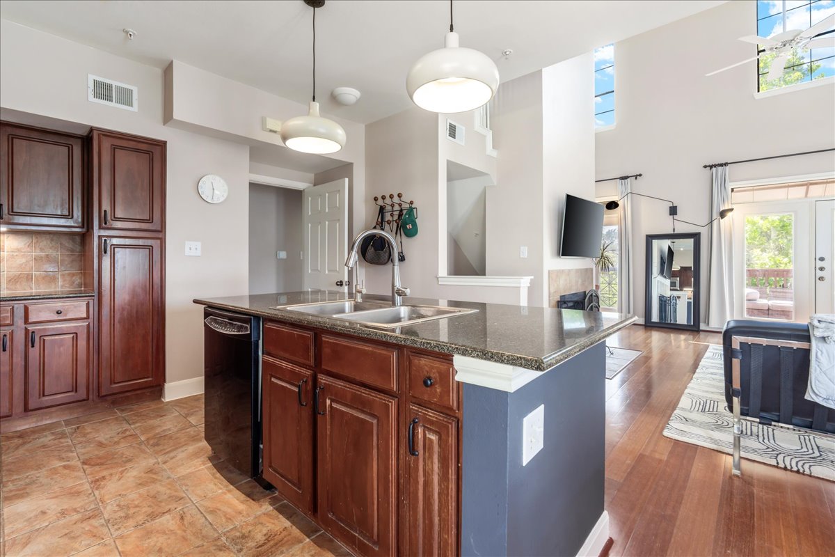 7701 Rialto Boulevard, Unit 91 Austin, TX 78735 - Photo 12 of 39 a kitchen with stainless steel appliances granite countertop a sink a stove and a refrigerator
