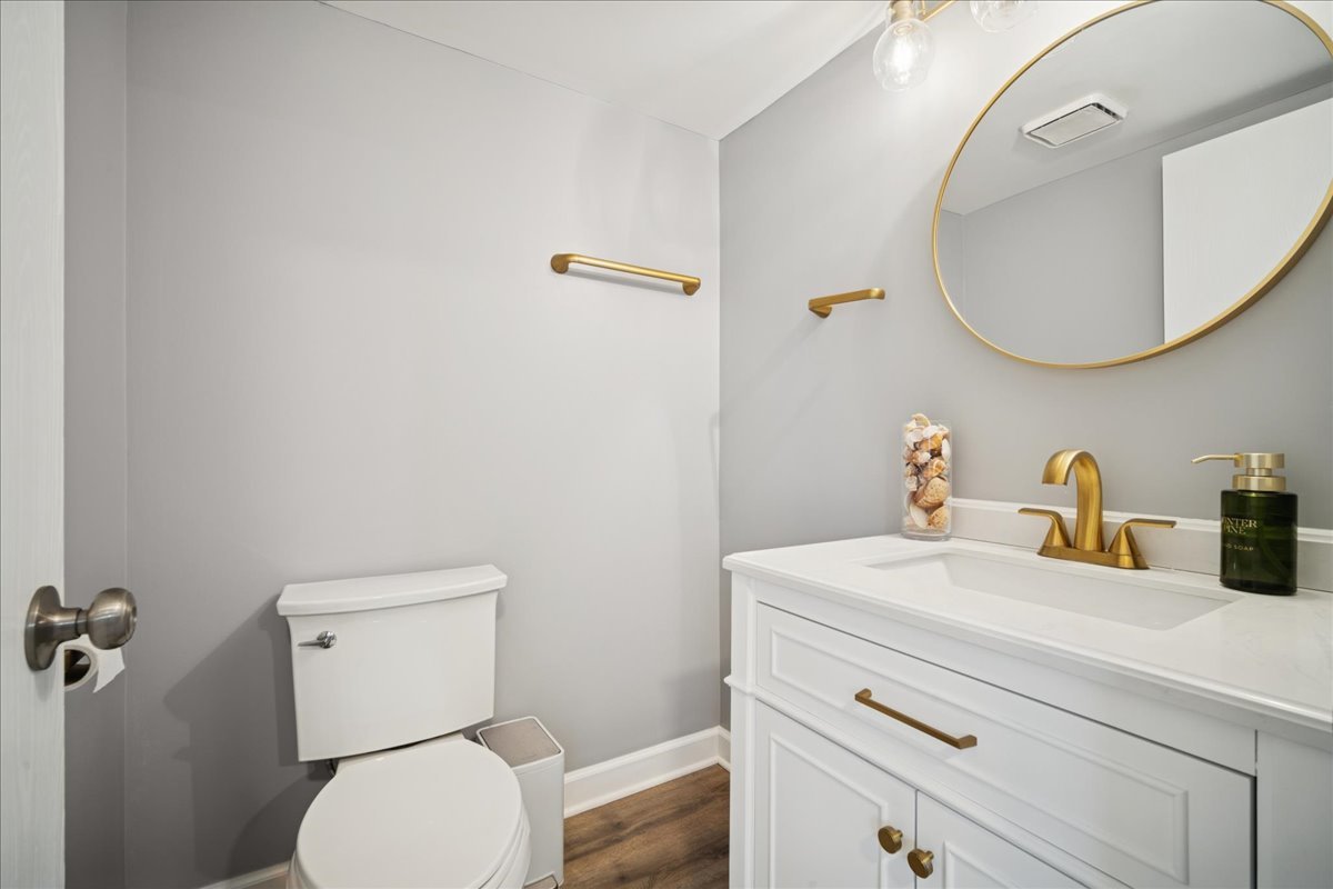 216 Winnsboro Court, Unit A Schaumburg, IL 60193 - Photo 11 of 20 a bathroom with a sink a toilet and a mirror