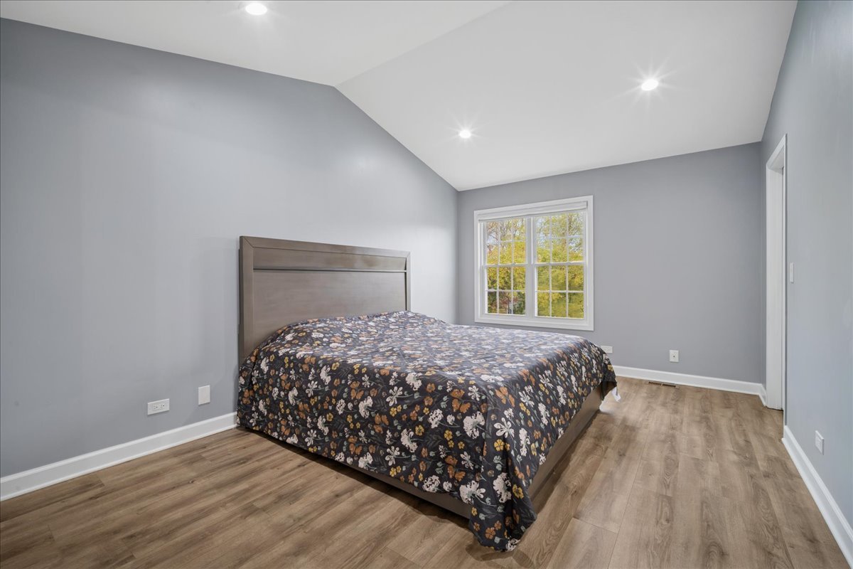 216 Winnsboro Court, Unit A Schaumburg, IL 60193 - Photo 12 of 20 a bedroom with a bed and a window