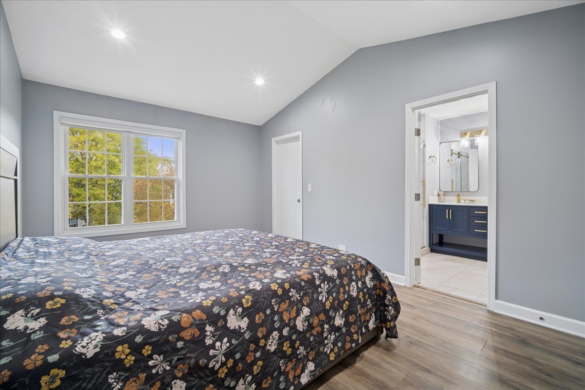 216 Winnsboro Court, Unit A Schaumburg, IL 60193 - Photo 13 of 20 a bedroom with a bed and a window