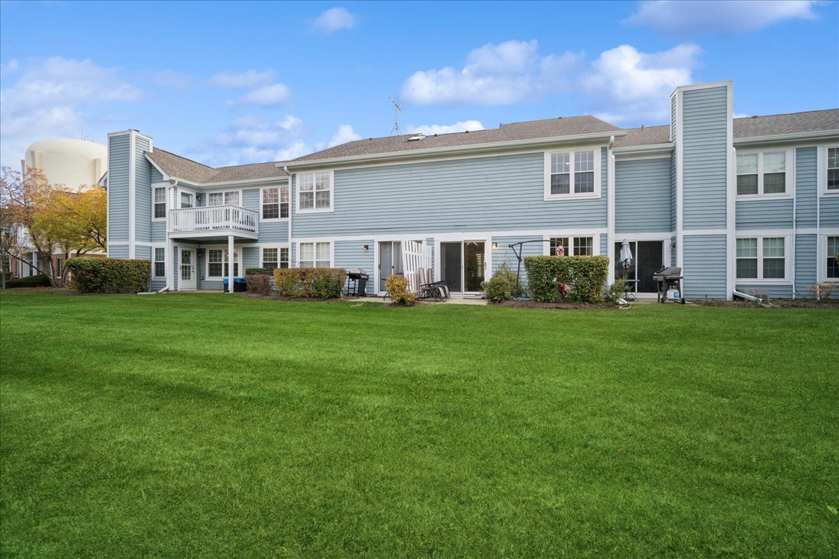 216 Winnsboro Court, Unit A Schaumburg, IL 60193 - Photo 19 of 20 a front view of building with yard