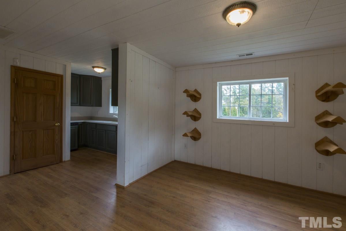 2730 Little River Church Road Hurdle Mills, NC 27541 - Photo 14 of 25 an empty room with windows and closet