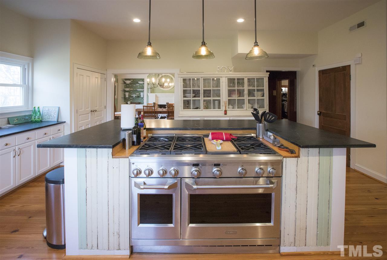 2730 Little River Church Road Hurdle Mills, NC 27541 - Photo 17 of 25 a stove top oven sitting inside of a kitchen