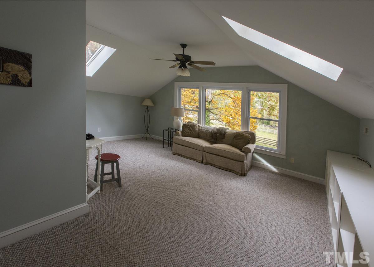 2730 Little River Church Road Hurdle Mills, NC 27541 - Photo 24 of 25 a living room with furniture and a window