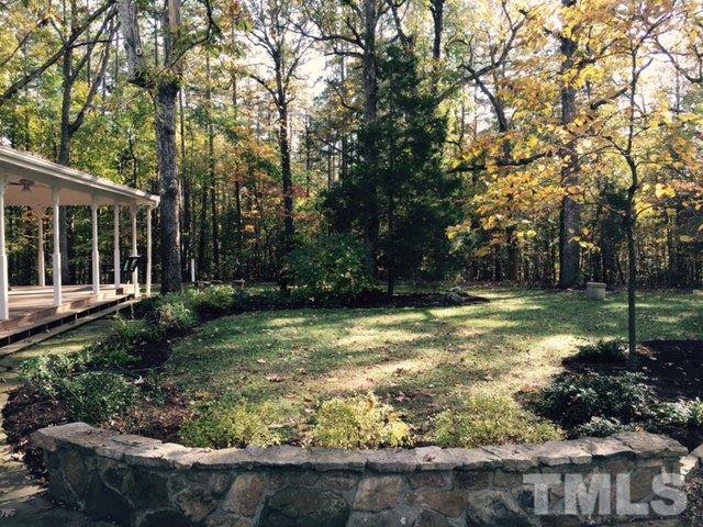 2730 Little River Church Road Hurdle Mills, NC 27541 - Photo 4 of 25 a view of a backyard with large trees