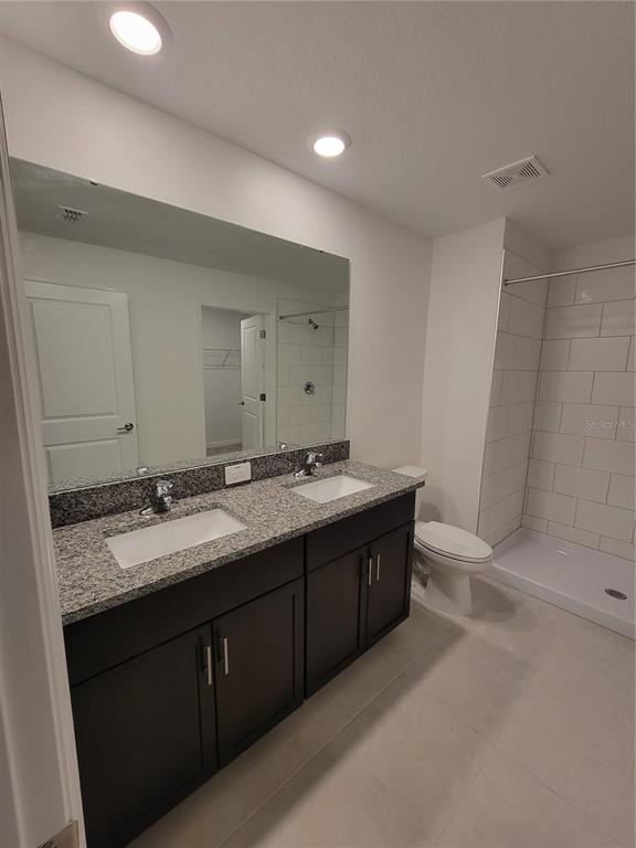 1844 Red Loop Lakeland, FL 33801 - Photo 18 of 24 a bathroom with a granite countertop sink and a mirror