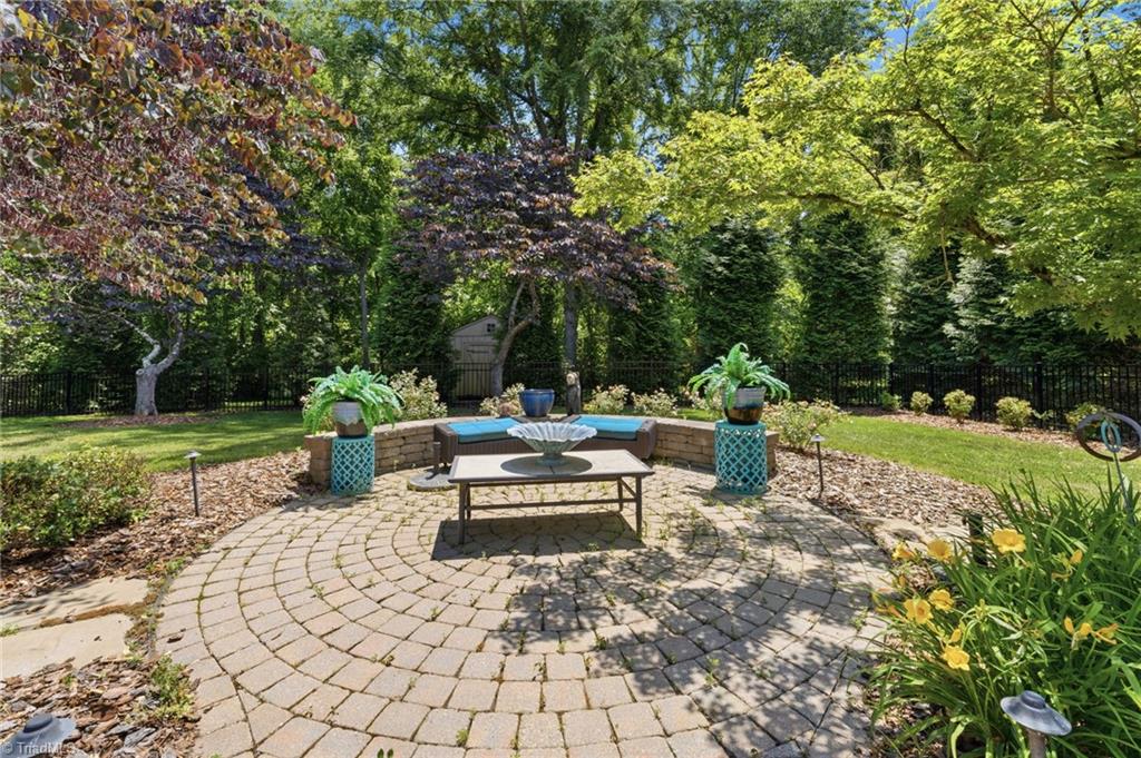 4253 Wayne Road Greensboro, NC 27407 - Photo 37 of 49 Brick patio. Center piece of backyard.