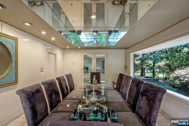 a view of a dining room with furniture window and outside view