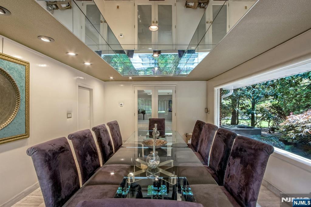 278 Fountain Road Englewood, NJ 07631 - Photo 11 of 37 a living room with furniture and a large window